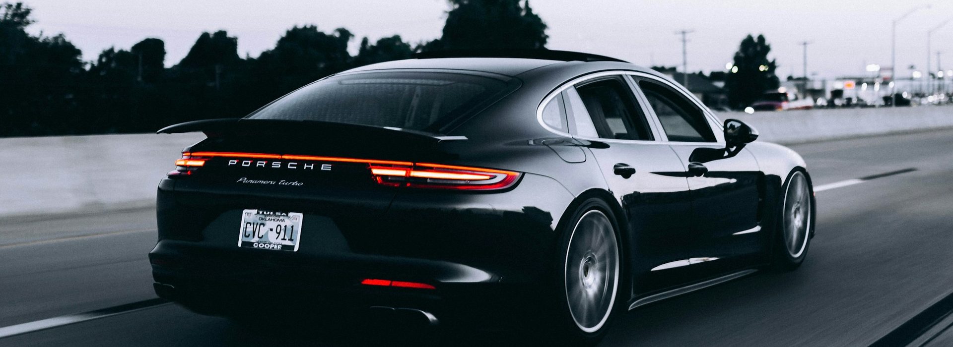 Black Porsche Panamera on the highway