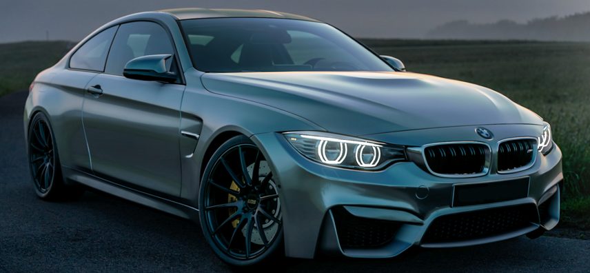 Modified BMW M4 with aftermarket wheels
